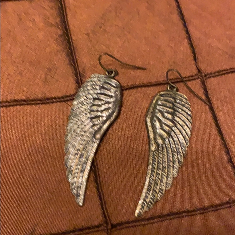 Silver colored angel wing earrings